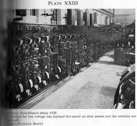 Plate XXIII (a). Power Station Switchboard about 1920. The board intended for low voltage has exposed live metal on slate panels, and the switches are operated manually. (Photo: London Electricity Board)