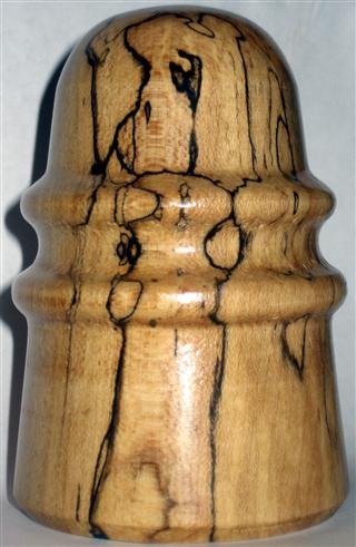 Wooden CD 124.  Light brown with black striping.  Elaine gave to Kyrie.