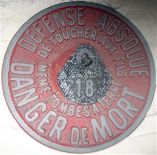 DEFENSE ABSOLUE
DE TOUCHE AUX FILS
MEME TOMBES A TERRE
DANGER DE MORT

Cast metal.  Center tag with 18