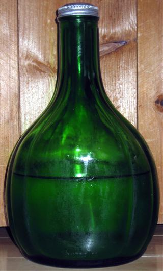 Green water bottle, 4 flutes on either side with 2 larger flat panels between.  Pourable cap in aluminium

Cap: PAT. 2017036

Bottom of bottle: (Front) Duraglas  (Rear) Duraglas 
Base: DES. PAT. 92828 / 2 / Z [OI trademark] 4