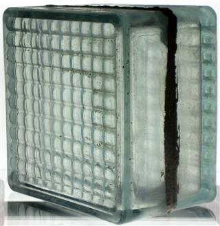 6" glass block.

Manufactured by Hemingray circa 1934-1935.  Early run before commercial use.  Makes use of aluminum weld.  Found in the machine room between A and B furnace in Muncie.