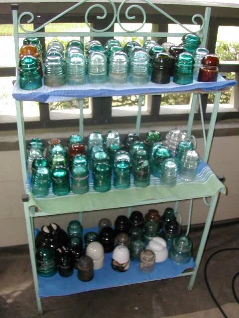 Patio shelf full of insulators